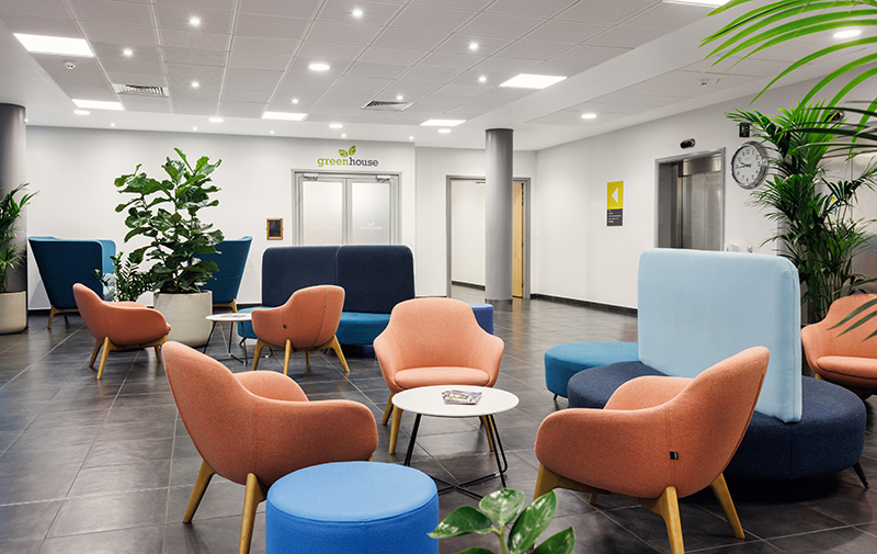 Gateshead College Baltic Campus reception, comfy peach coloured chairs and large plants